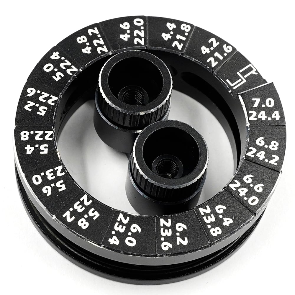 Yeah Racing aluminum round droop gauge for 1/10 touring car, showing detailed black aluminum construction and measurement markings.