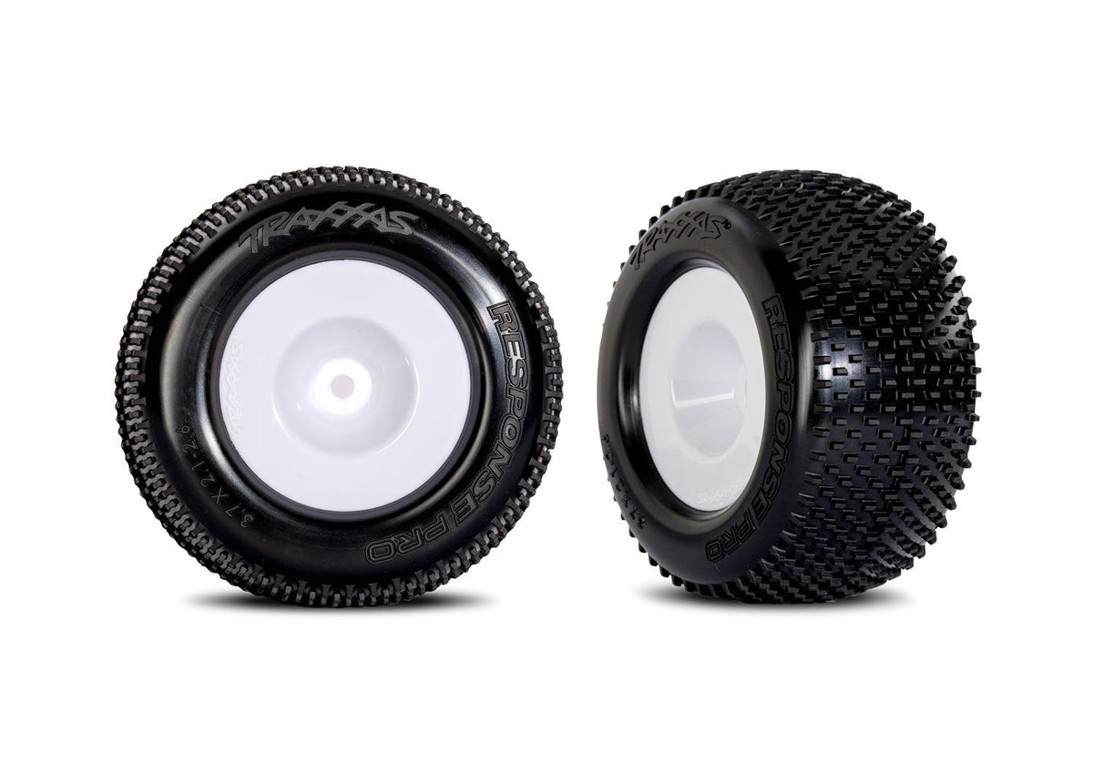 Pair of white dished wheels with Response Pro tires for Traxxas remote control cars, shown in a close-up image.