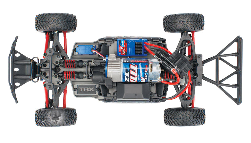 Traxxas 1/16 Slash 4X4 remote control truck with off-road tires and detailed body, shown in a vibrant red color.
