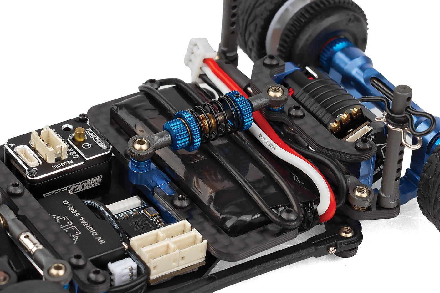 RC28 Team Associated RC car kit with central shock absorber, detailed chassis components, and brand-specific design features.