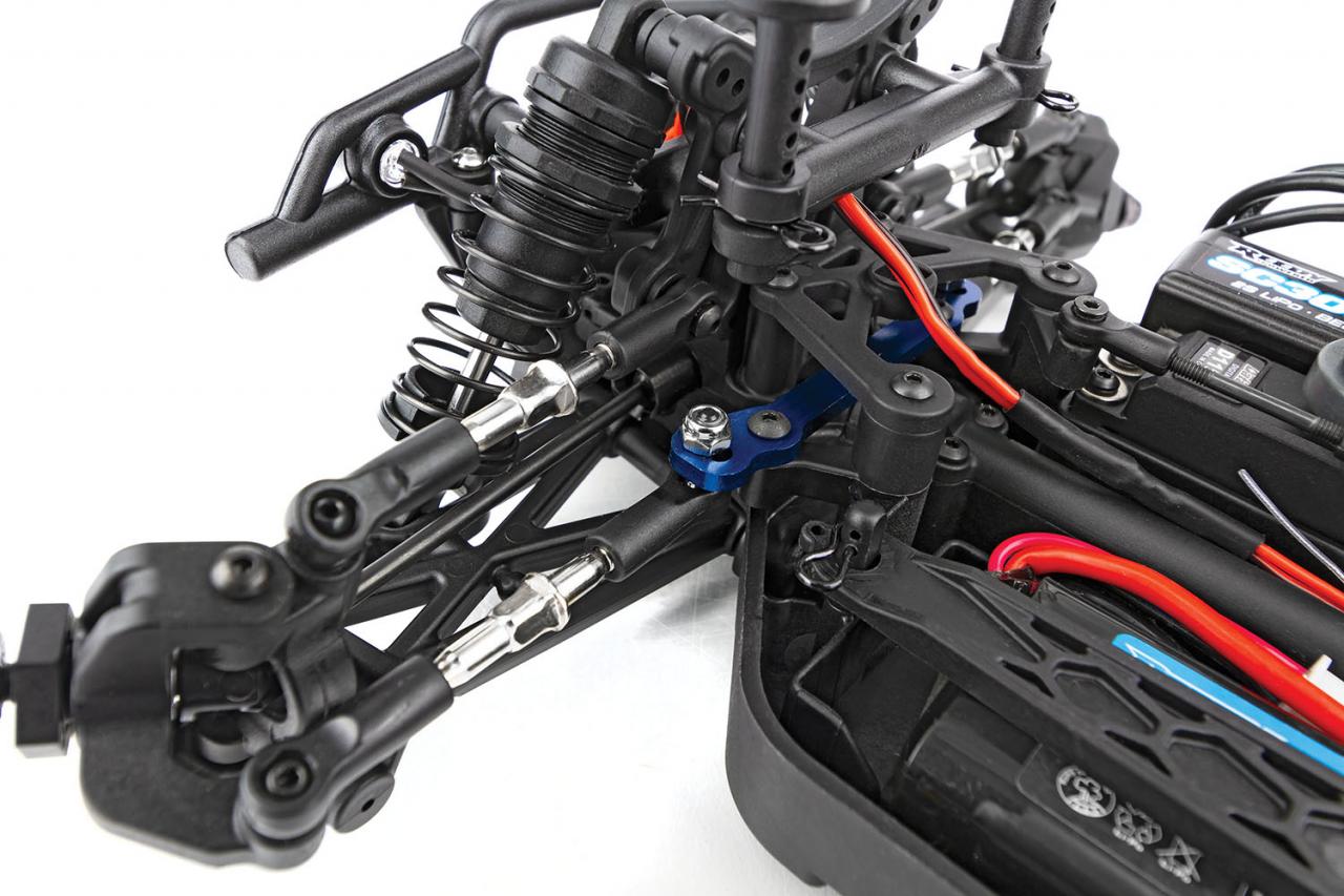 Team Associated Reflex 14MT 1/14 4WD RC monster truck with front steering and large tires, shown from the front angle.