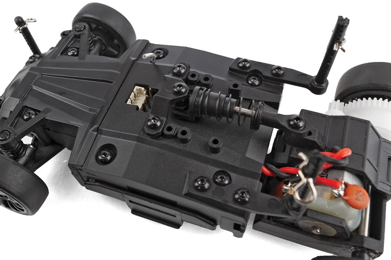 Team Associated SR27 Nissan Z RTR RC car with detailed body, racing wheels, and shock absorbers visible in the image.