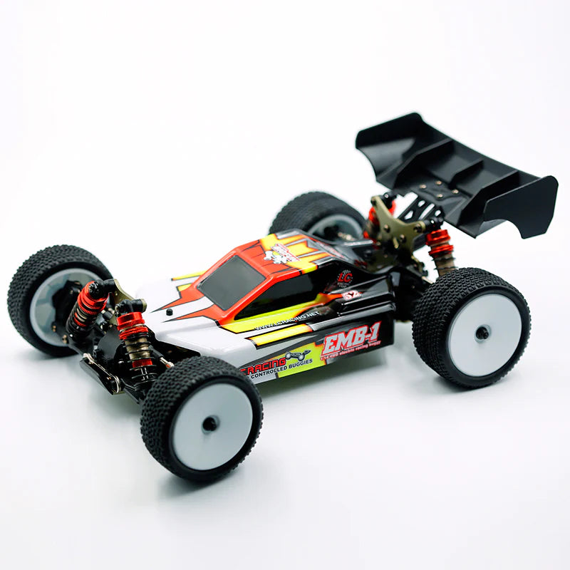 LC Racing EMB-1 1/14 scale 4WD RTR buggy, detailed close-up showing chassis, tires, and suspension components.