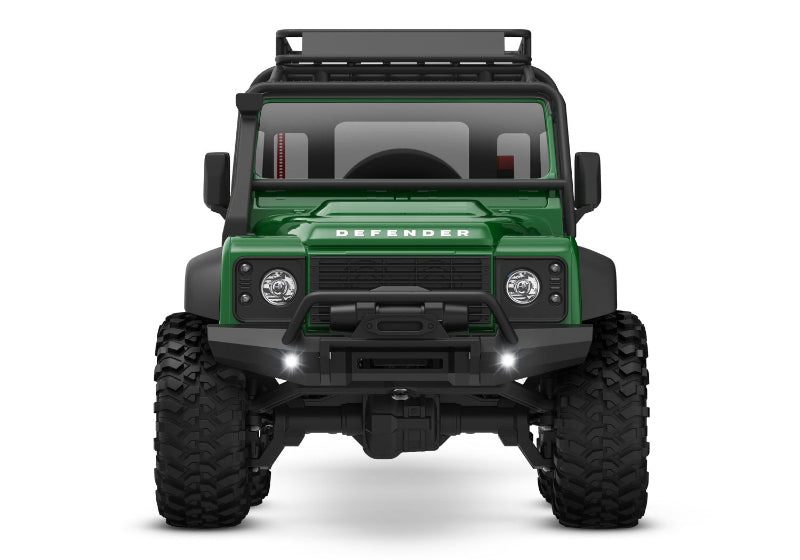 Green Traxxas TRX-4M Land Rover Defender RC truck front view showing detailed exterior and rugged design.