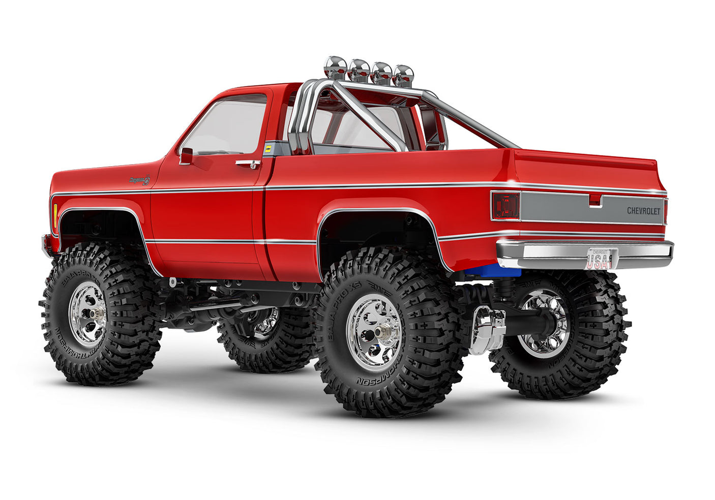 Red Traxxas TRX-4M 1/18 scale Chevrolet K10 High Trail Edition remote control truck, rear three-quarter view.