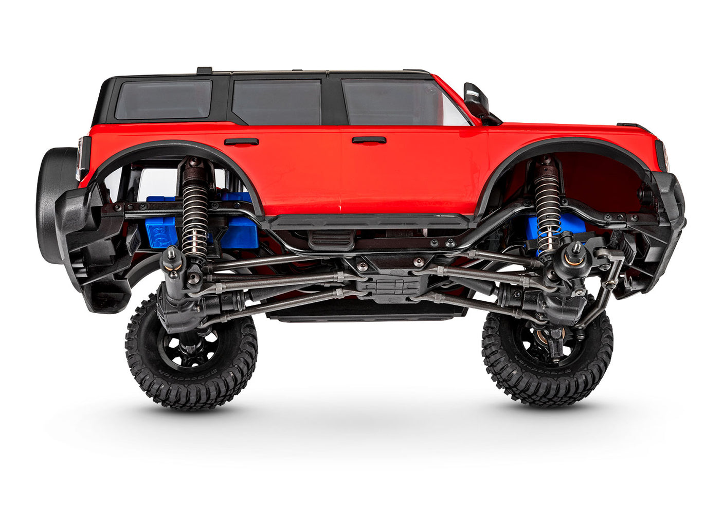 Traxxas TRX-4M Ford Bronco RC crawler with detailed body and realistic design, shown on a tilted surface.