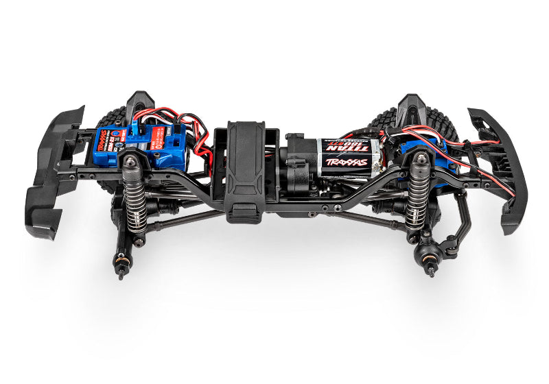 Traxxas TRX-4M Land Rover Defender RC model with detailed chassis and Bronco slider components.