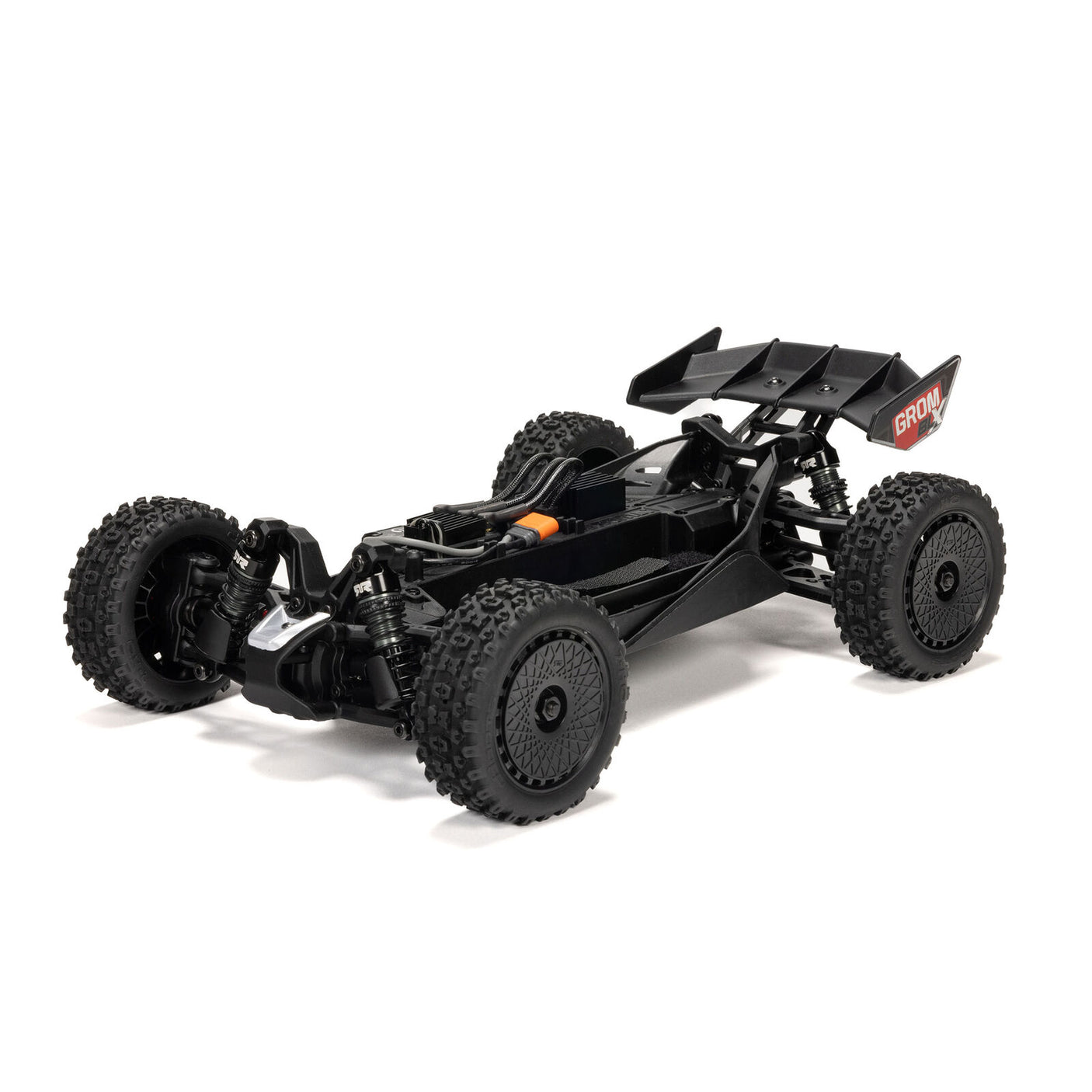 Silver ARRMA 1/14 Typhon GROM 223S DSC 4x4 RTR brushless buggy on a track, showcasing its detailed design and rugged build.