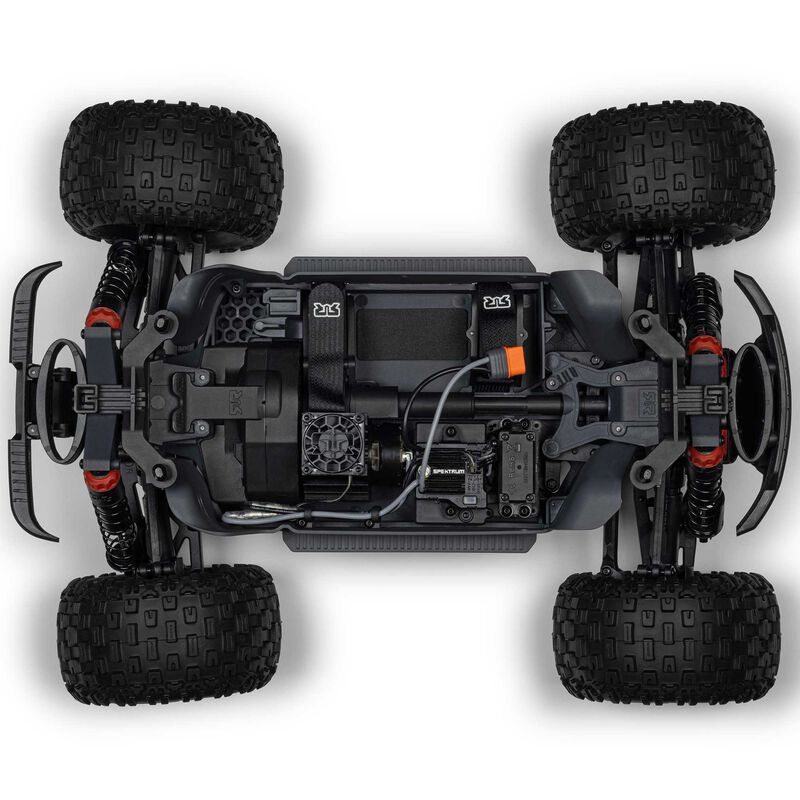 ARRMA 1/10 scale Granite 4x4 RTR brushed monster truck with rugged tires and vibrant orange and black body on off-road terrain