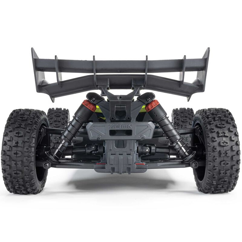 ARRMA 1/8 scale TYPHON 4x4 RTR brushed buggy on rugged terrain, showcasing its off-road design and vibrant orange color.