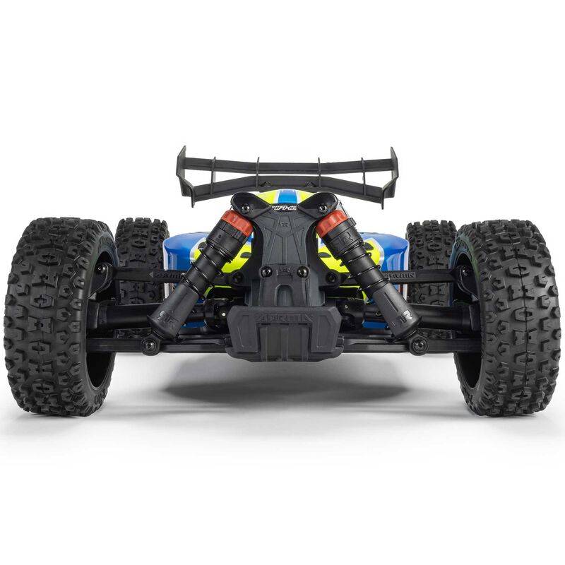 ARRMA 1/8 Typhon 4x4 RTR brushed buggy on rugged terrain with detailed body and large tires, ready for off-road racing.