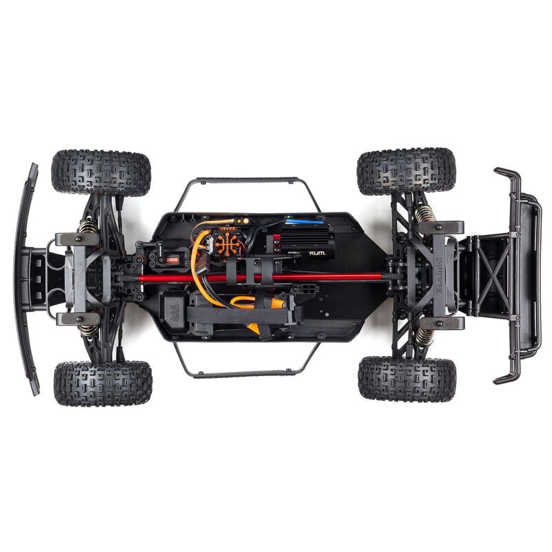 ARRMA Mojave 6S 4x4 RTR brushless short course truck, showing its rugged off-road design and bright orange body with large tires.