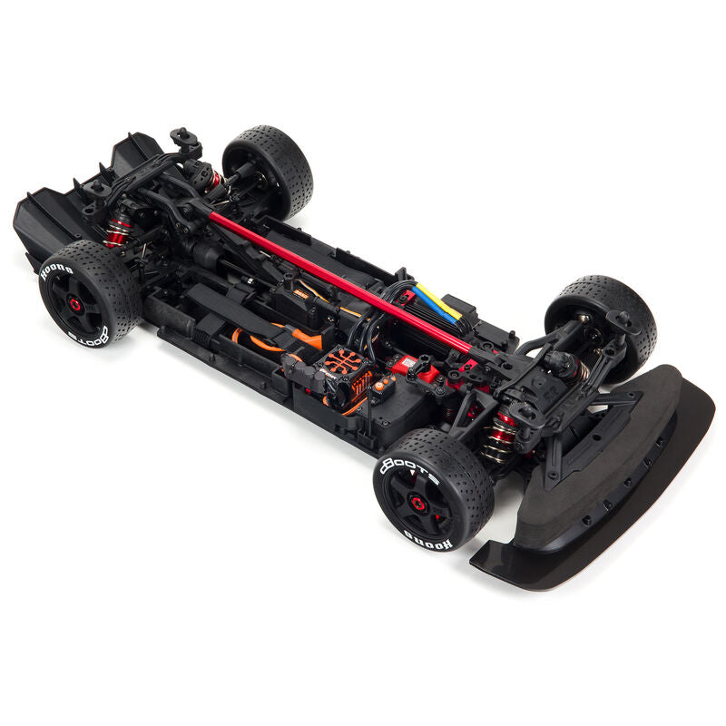 ARRMA 1/7 Infraction 6S AVC 4X4 RTR street basher RC car on pavement with detailed body and large off-road tires.