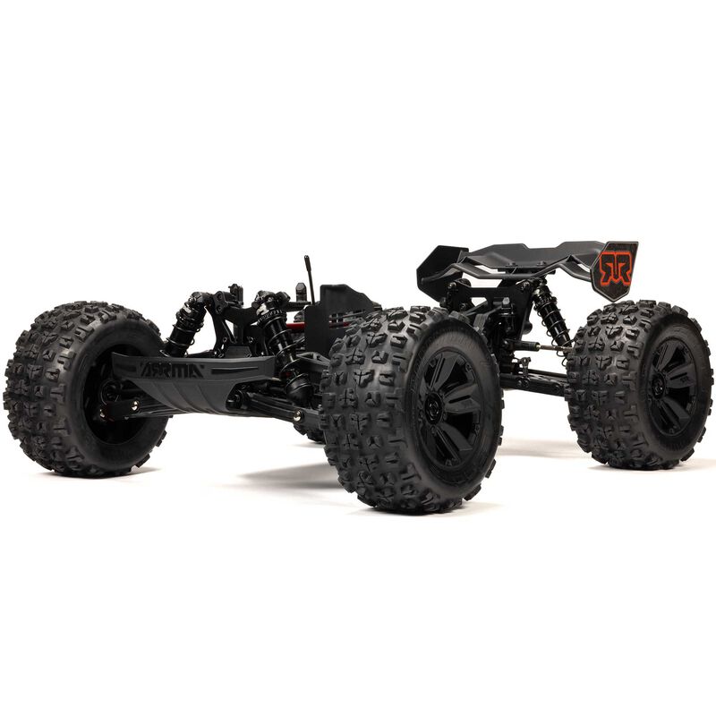 ARRMA 1/8 Kraton 6S BLX V6 4x4 remote control monster truck on rugged terrain, showcasing its powerful design and vibrant color.