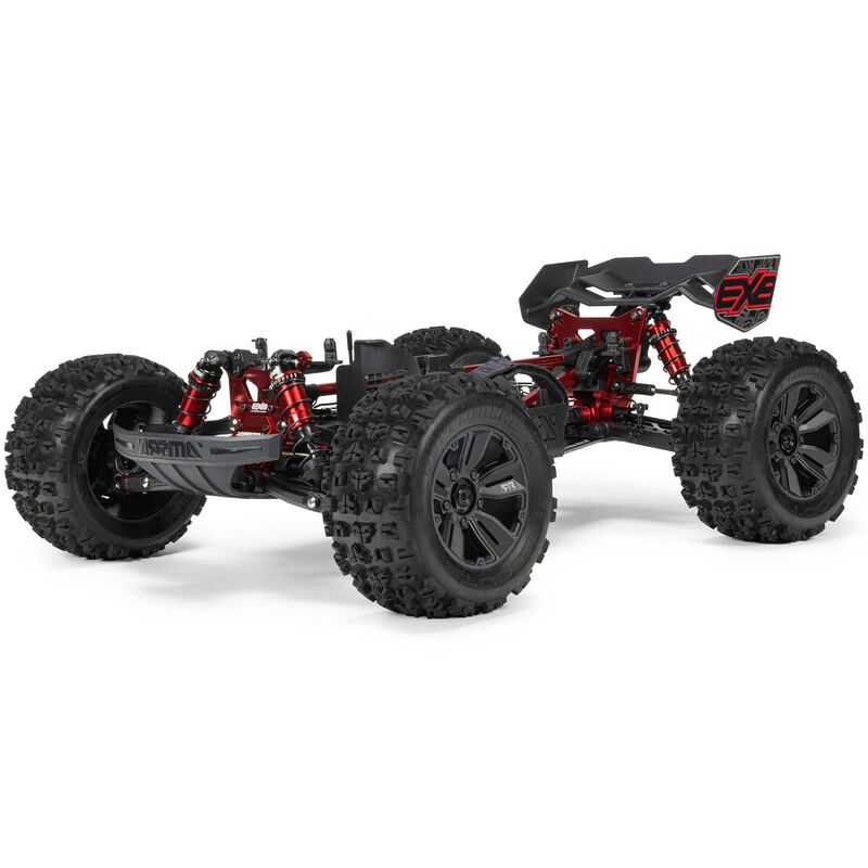 Red and black ARRMA 1/8 Kraton 6S EXB 4x4 RTR RC car on rugged terrain, showcasing its powerful off-road design.