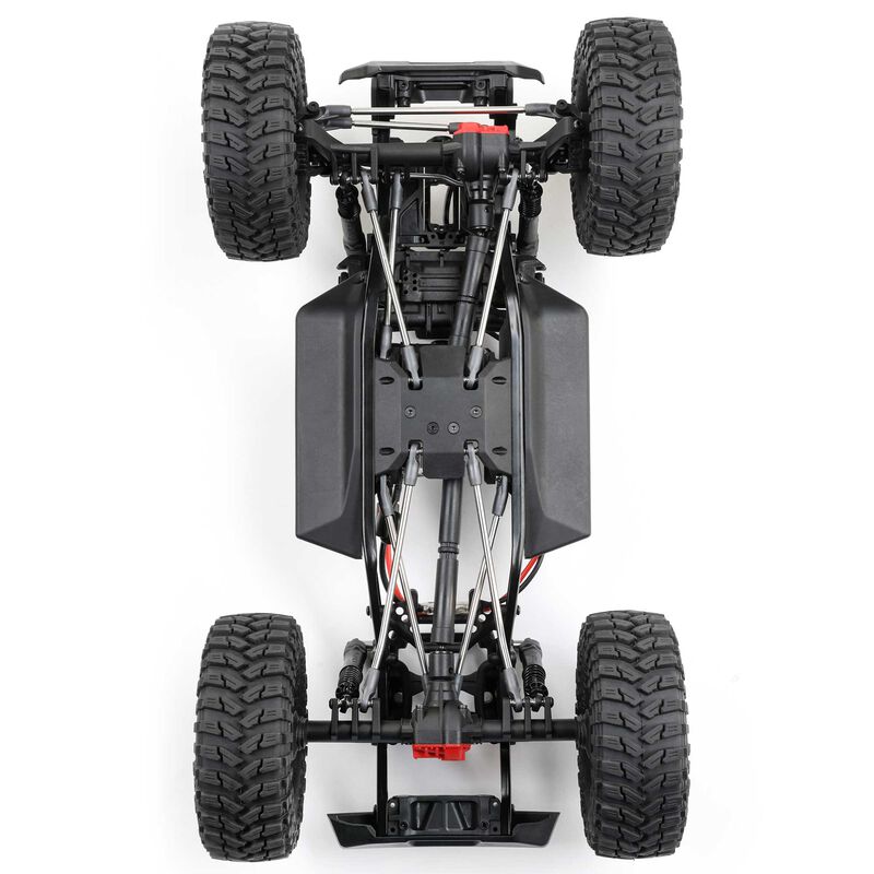 Axial 1/10 SCX10 III Coyote 4x4 RTR brushed rock crawler showing detailed chassis and rugged tires in outdoor terrain