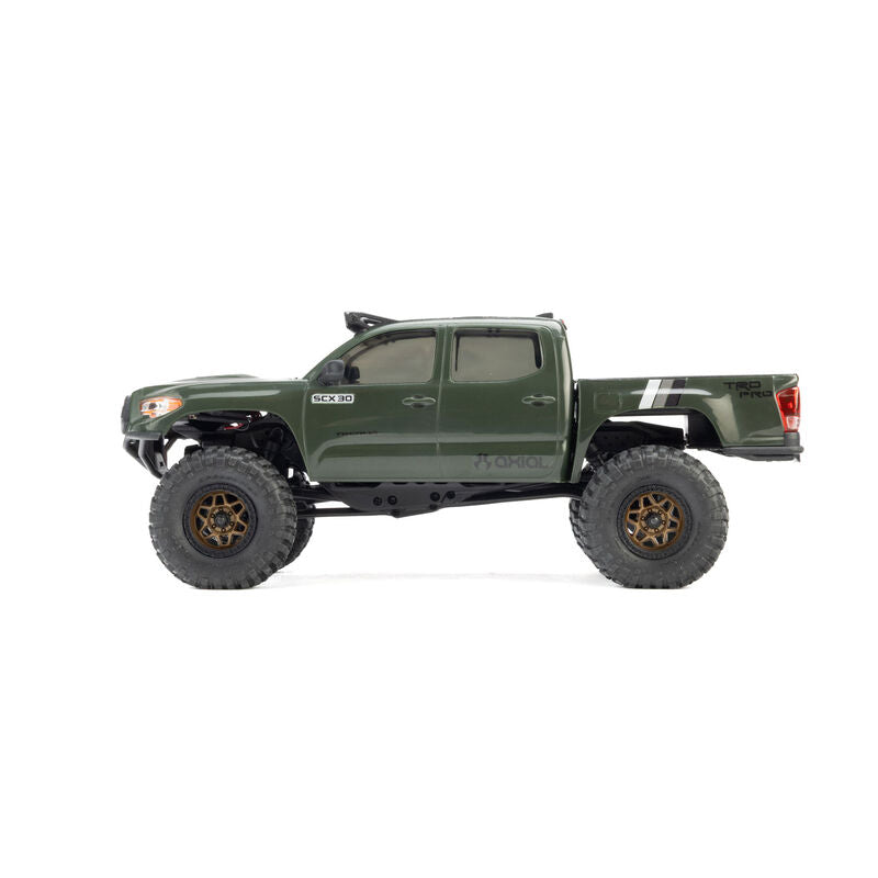 Axial SCX30 Toyota Tacoma TRD Pro 1/30 scale RTR rock crawler off-road vehicle on rugged terrain