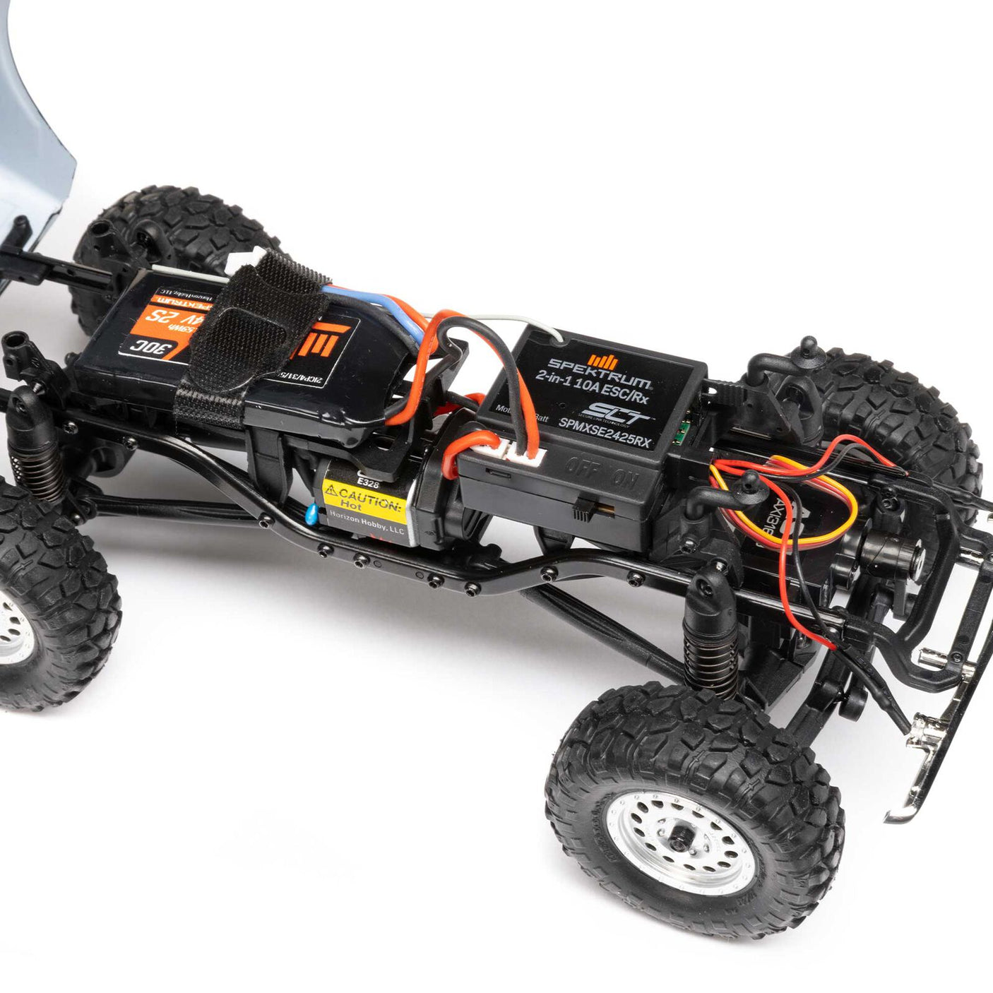 Axial 1/24 scale SCX24 Chevrolet C10 4WD truck RTR model with detailed blue and white body and rugged off-road tires.
