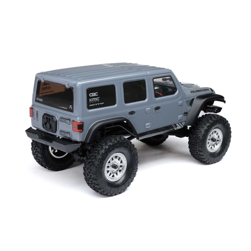 Axial 1/24 SCX24 2019 Jeep Wrangler JLU CRC 4x4 brushed rock crawler model on rugged terrain with detailed exterior