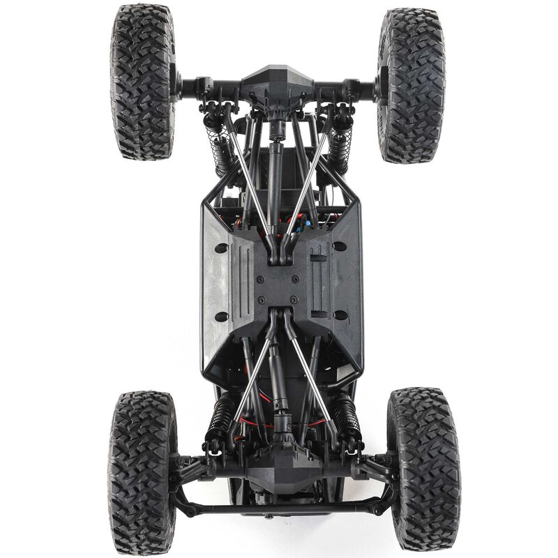 Axial 1/18 scale Capra 4WD RTR trail buggy in black and green with detailed rugged design and off-road tires.