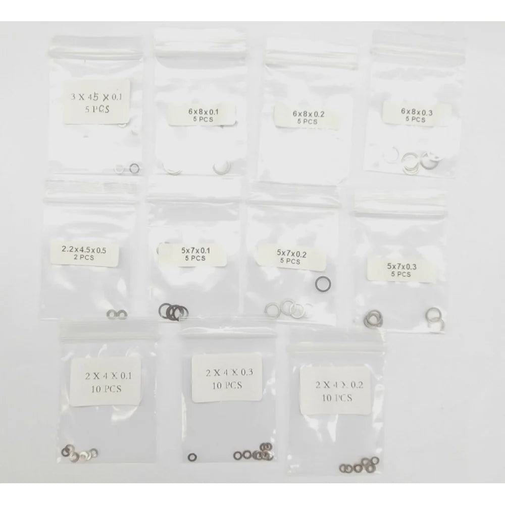GL Racing Giulia shim set GG-S-031, close-up of metal shims with precise edges, used for automotive adjustments and tuning.