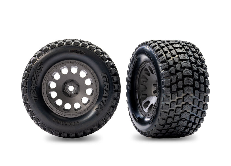 Pair of gray Traxxas Gravix pre-mounted rear tires for Mini XRT remote control truck, showing tread pattern and sidewall details.