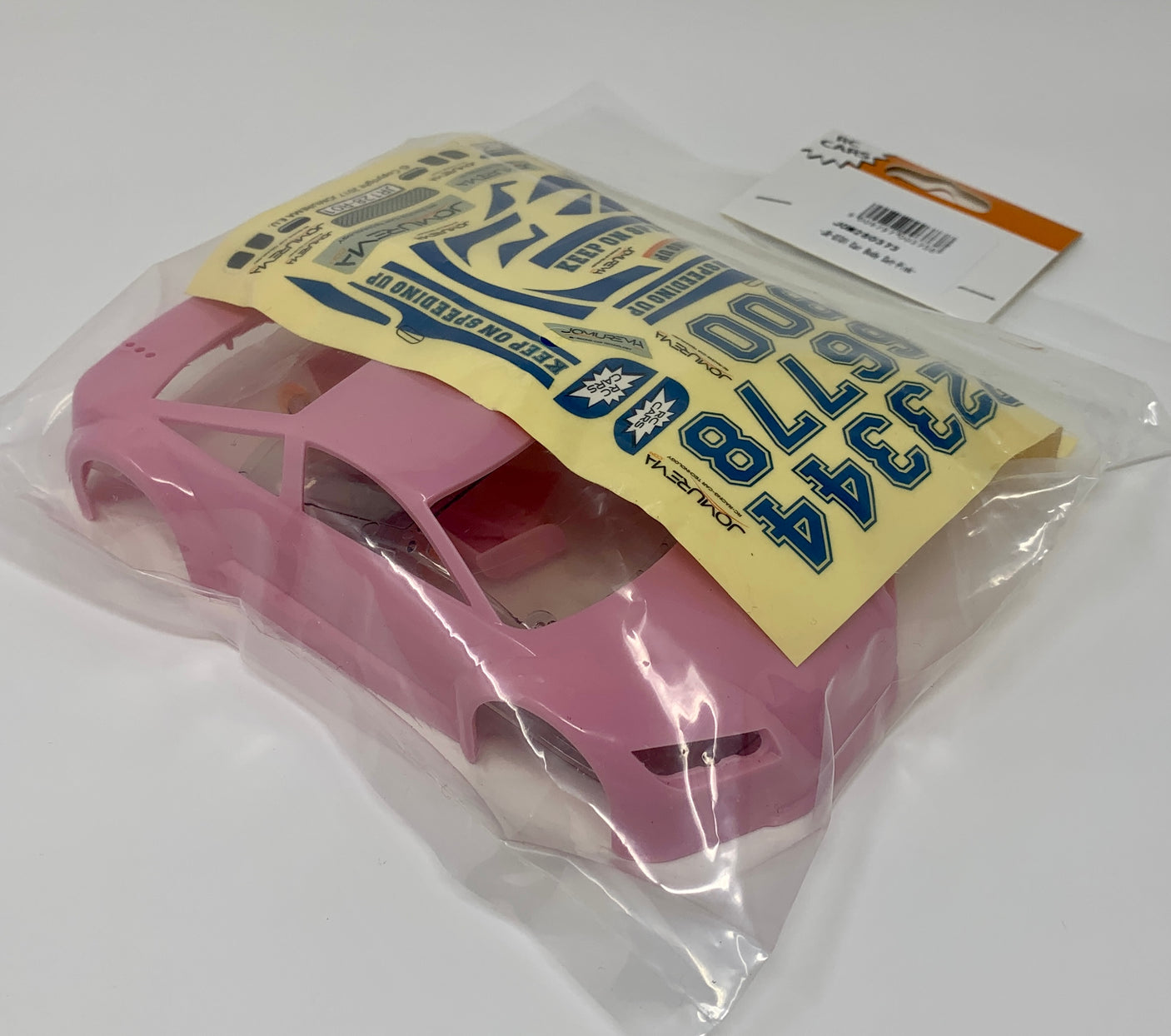 Light pink Jomurema GT01 car body set for model vehicles, shown on a clean background, highlighting the detailed design and color.