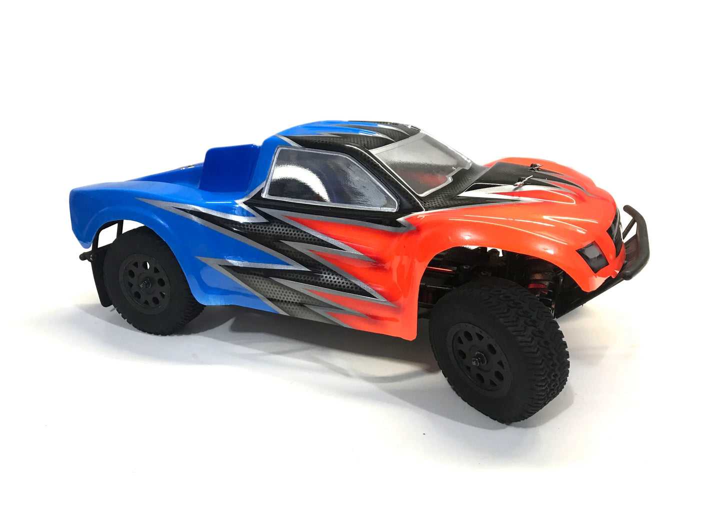 RC body for Phat Bodies Raptor SCT with 225mm wheelbase, shown on a model RC car, featuring detailed design and aerodynamic shape.