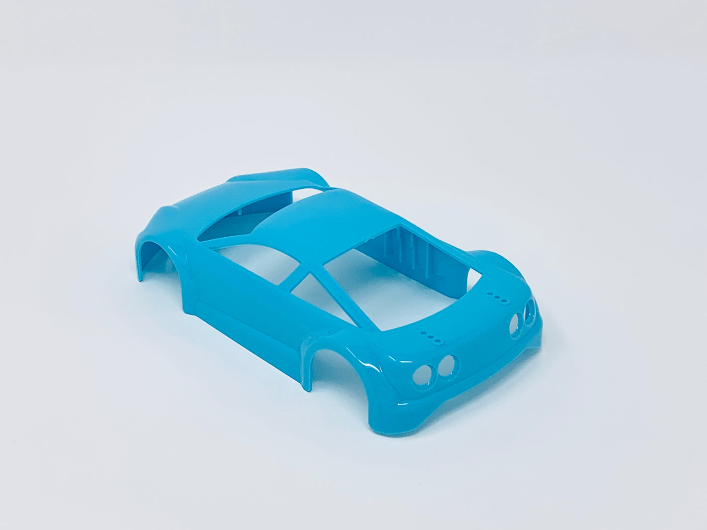 Jomurema GT01 car body set in neon blue with sleek aerodynamic design and detailed finish, suitable for custom car modifications.