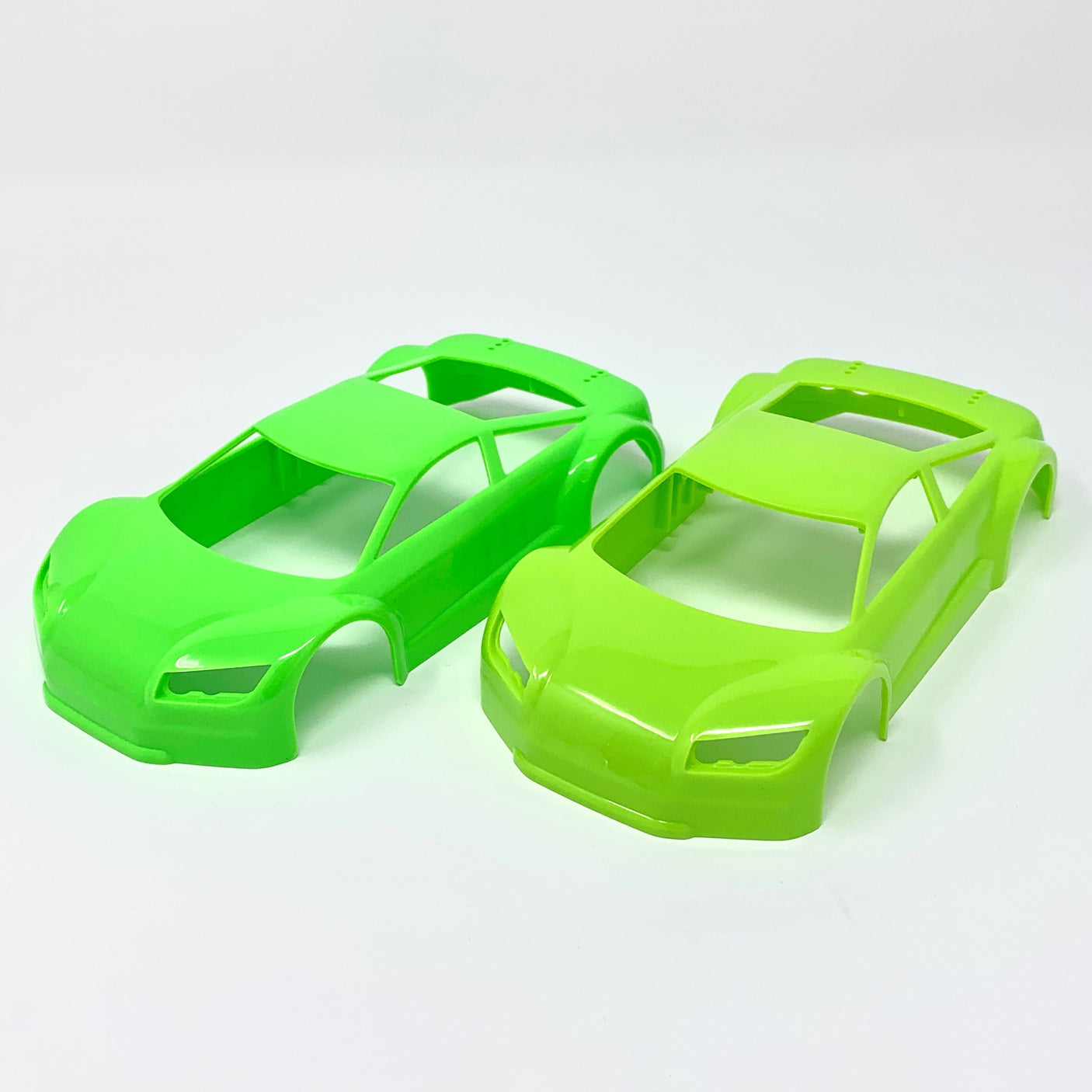 Jomurema GT01 car body in neon green with black accents, showcasing sleek aerodynamic design and detailed surface texture.