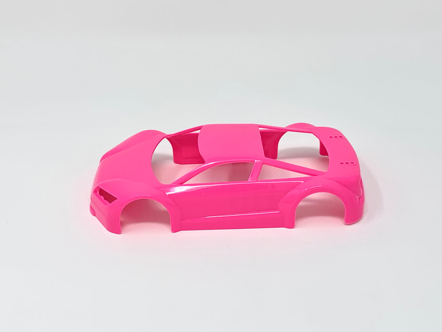 Jomurema GT01 car body set in vibrant neon pink, designed for customizing and enhancing vehicle appearance.