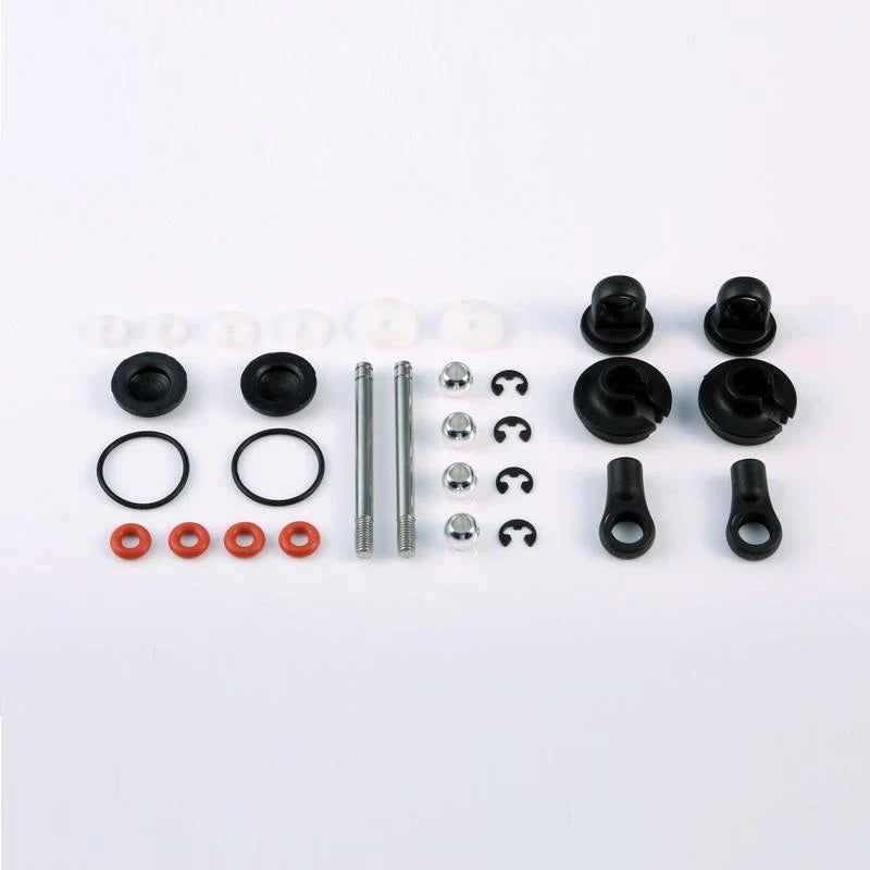 LC Racing L6121 front shock accessories, close-up of black shock parts with metallic fittings for RC vehicle suspension.