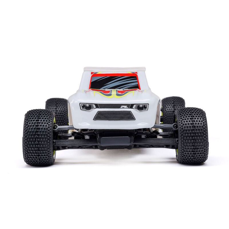 Losi Micro-T 2WD 1/28 scale truggy RC car with detailed body and off-road tires on a race track.