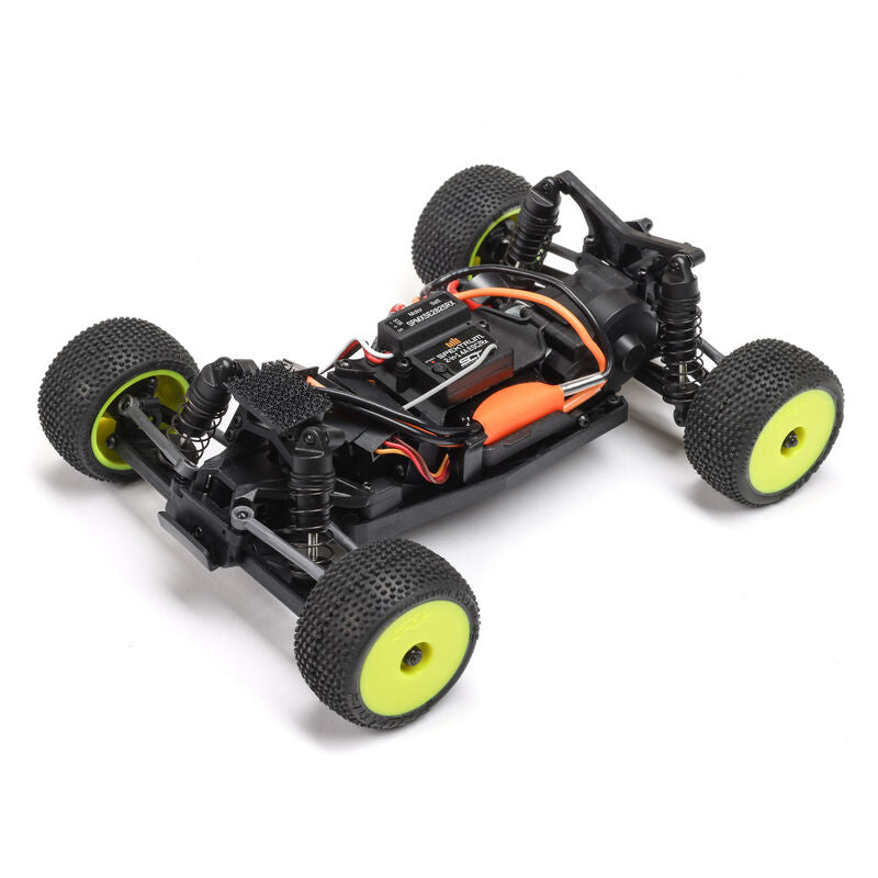 Losi Micro-T 2WD 1/28 scale truggy RC car with detailed black and red body and rugged tires on a dirt track