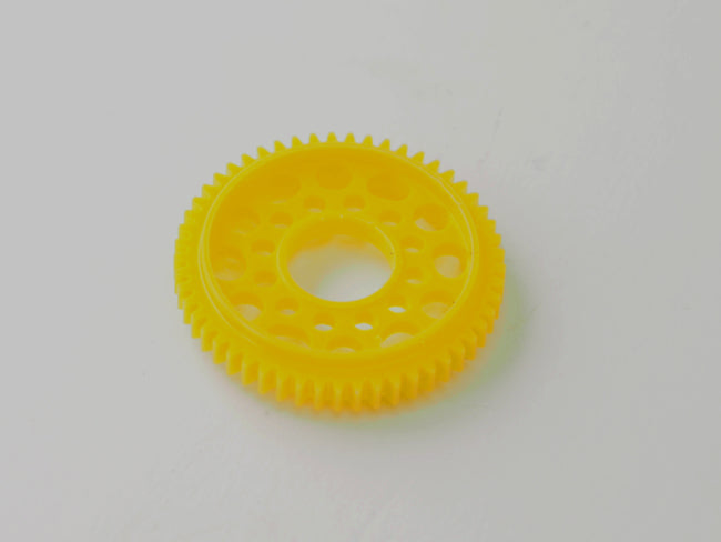 PN Racing machine cut Delrin 64P 53T PNWC spec spur gear for RC cars, showing the gear's detailed teeth and durable material.