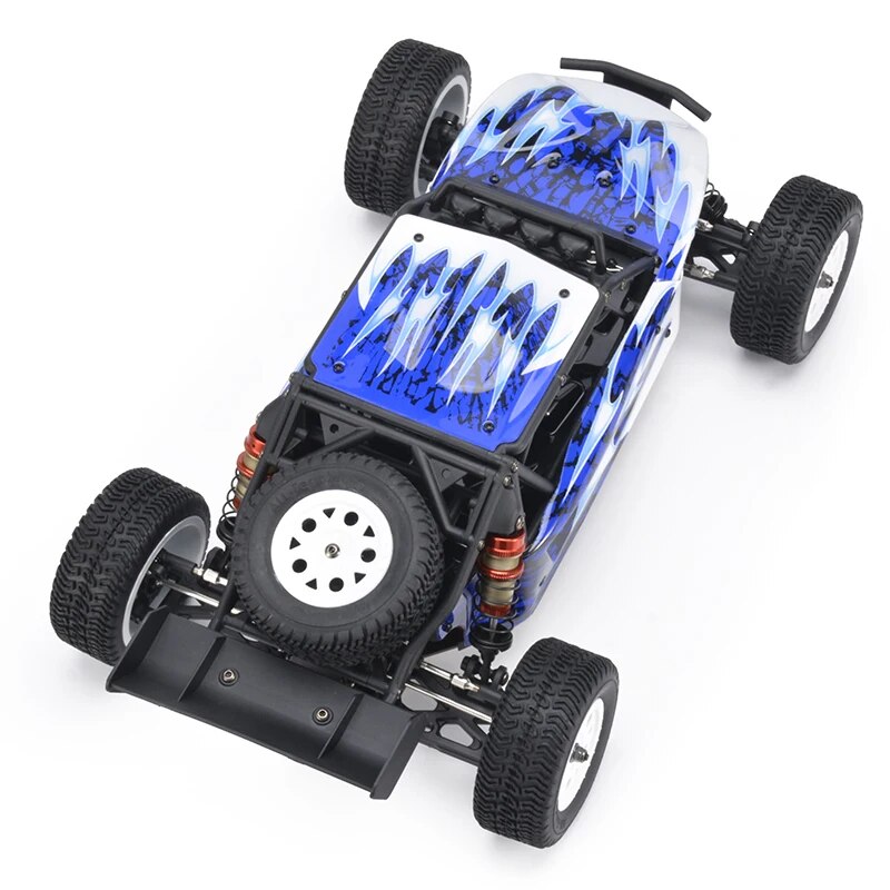LC Racing EMB-DT 1/14 scale 4WD RC desert truck with brushless motor, rugged tires, and detailed desert truck body.