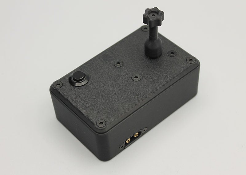 Reflex Racing RRE011 tire gluing machine for 1:28 scale RC cars, shown with parts and tools for precise tire assembly.