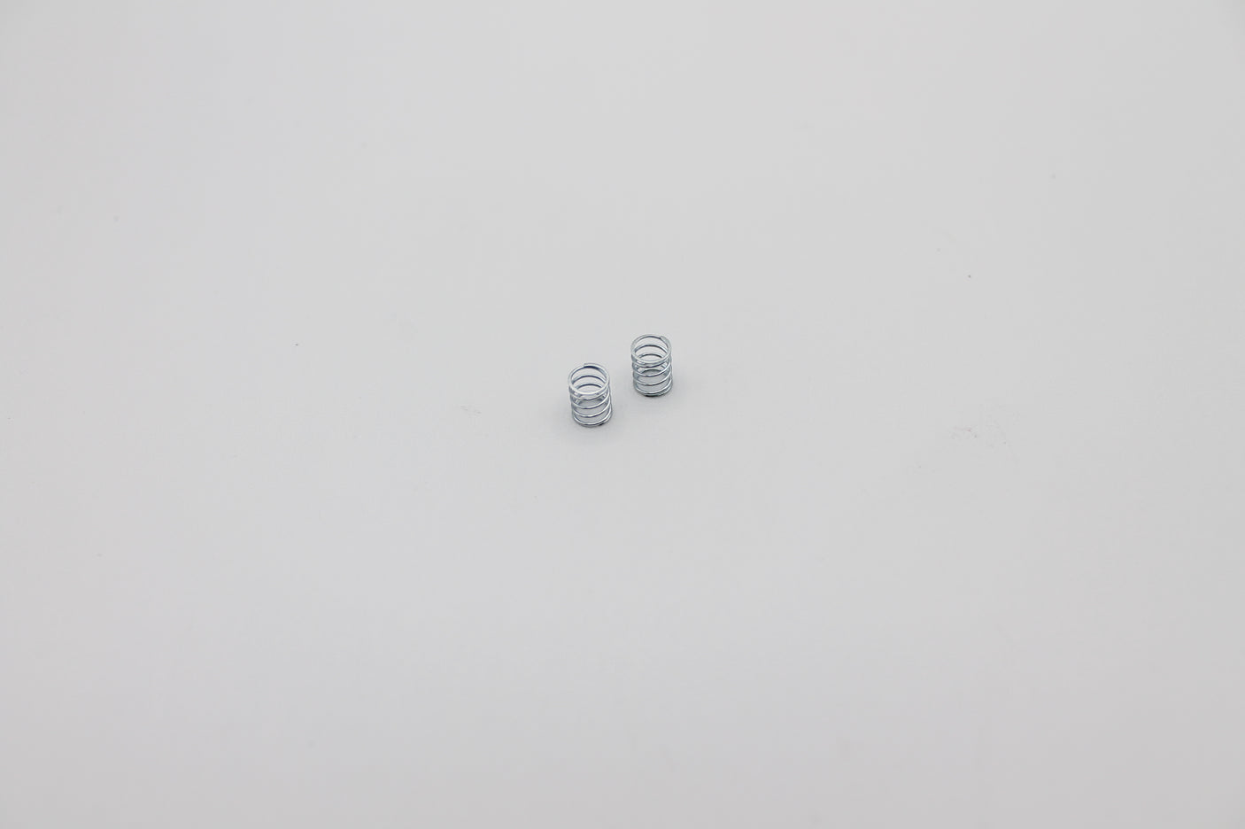 Reflex Racing RX28A-11 medium blue and silver front springs for RC car, showing coil design and color details.