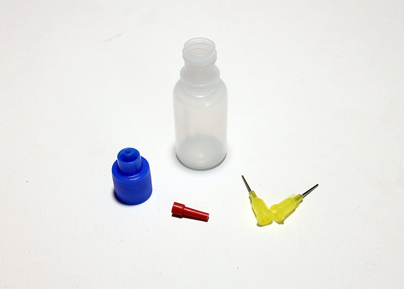 Reflex Racing RX400 tire glue bottle with precision tips for RC car tire assembly and maintenance.