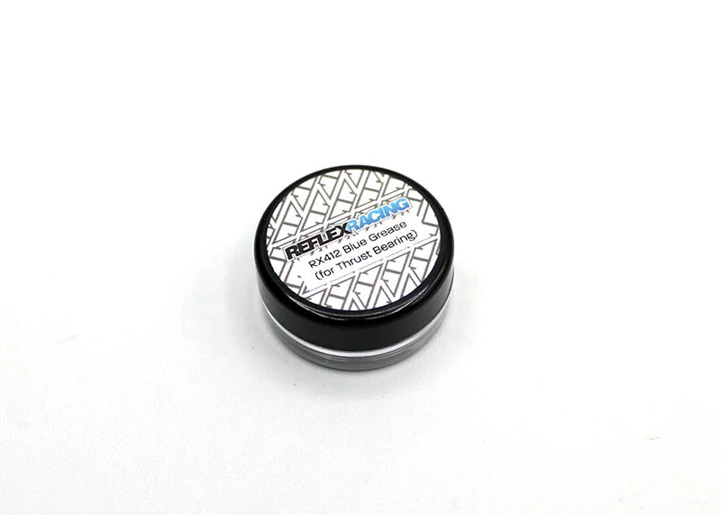 Reflex Racing RX412 Blue Thrust Grease for RC cars, 3g tube, shown in a close-up image with the blue grease visible in the tube.