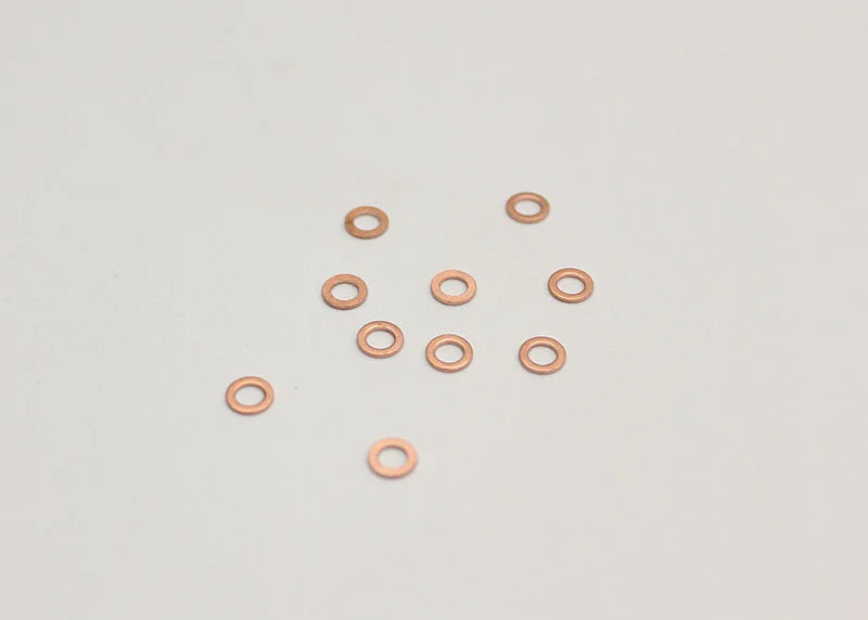 Reflex Racing RX501 M3x0.5mm rear axle shims for RC cars, set of 10, small metal spacers for precise wheel fitment.