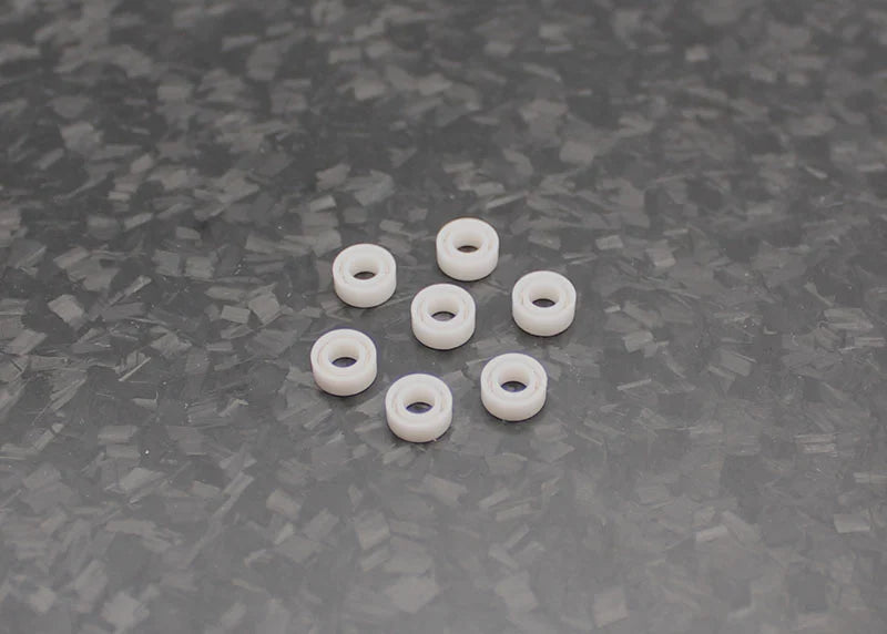 Reflex Racing RX542 full ceramic RC car bearing set with three 6x2.5mm bearings on a white background.
