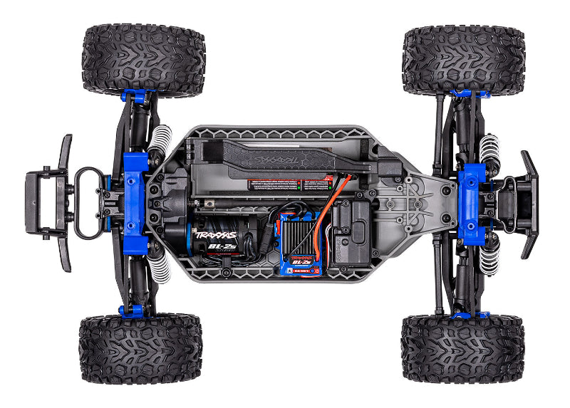 Traxxas Rustler 4X4 BL-2s remote control truck with black and red body, off-road tires, and detailed design.