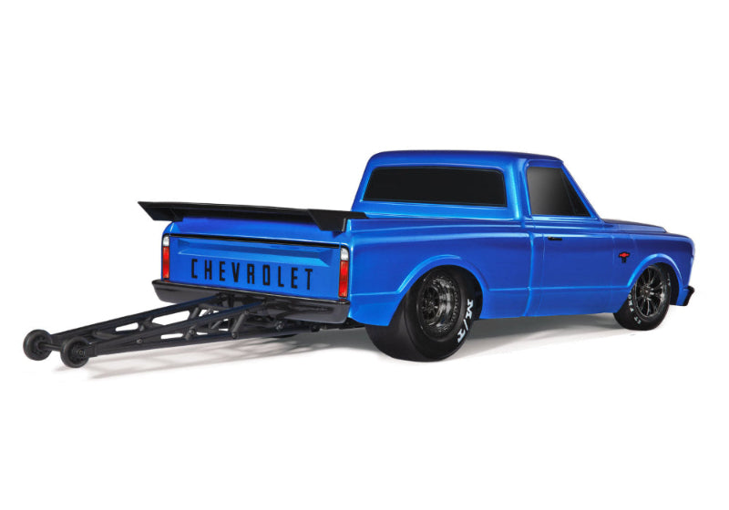 Traxxas Drag Slash C10 HD RC truck with detailed black and red body, large tires, and racing design for high-performance drag racing.