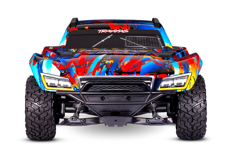 Traxxas Maxx Slash 6s remote control monster truck with large tires and vibrant red and black body, ready for off-road racing.
