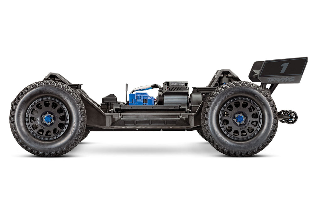 Orange Traxxas XRT 8S radio-controlled monster truck with large tires and detailed body in a dynamic outdoor setting.