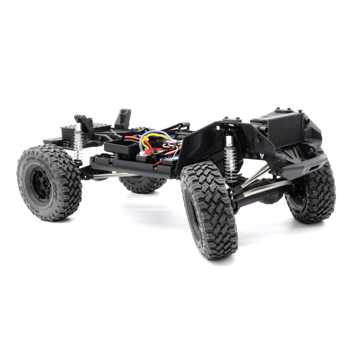 Vanquish VS4-10 Phoenix RTR remote control truck with black chassis, detailed body, and rugged tires for off-road driving.