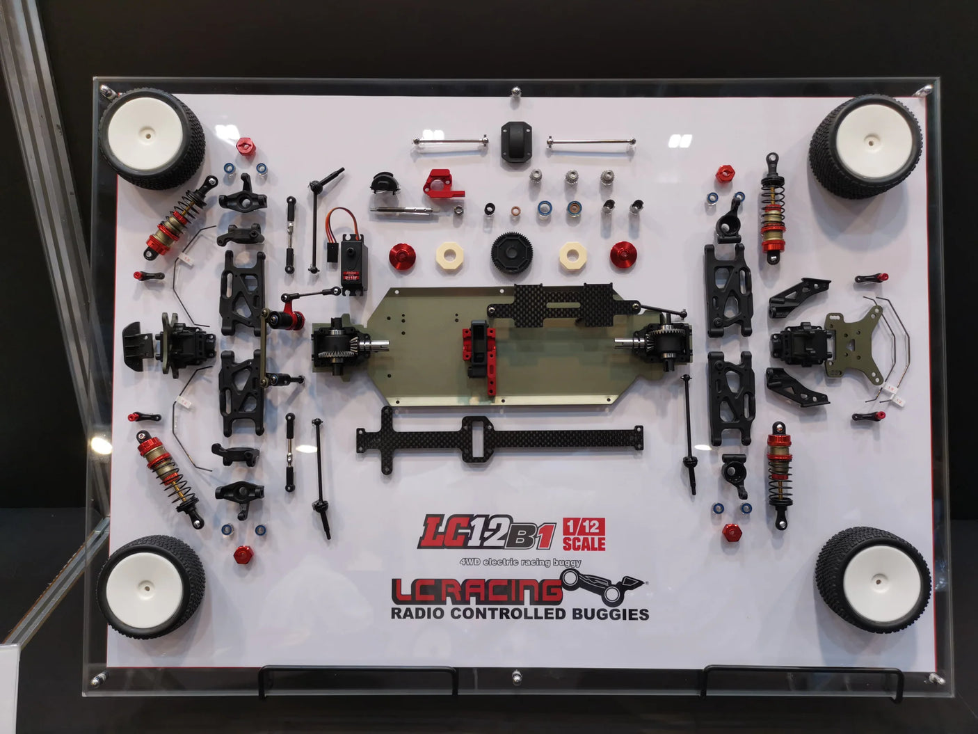 LC Racing LC12B1-HK 1/12 scale 4WD competition buggy kit, featuring detailed chassis and off-road racing components.