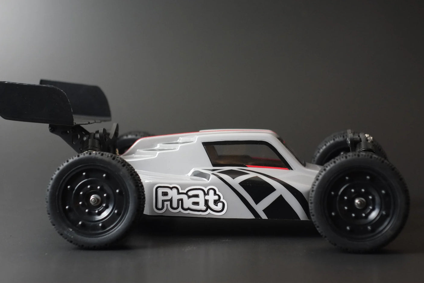 RC car Phat Bodies ATAK Buggy Body for 190mm wheelbase, featuring sleek design and detailed graphics.