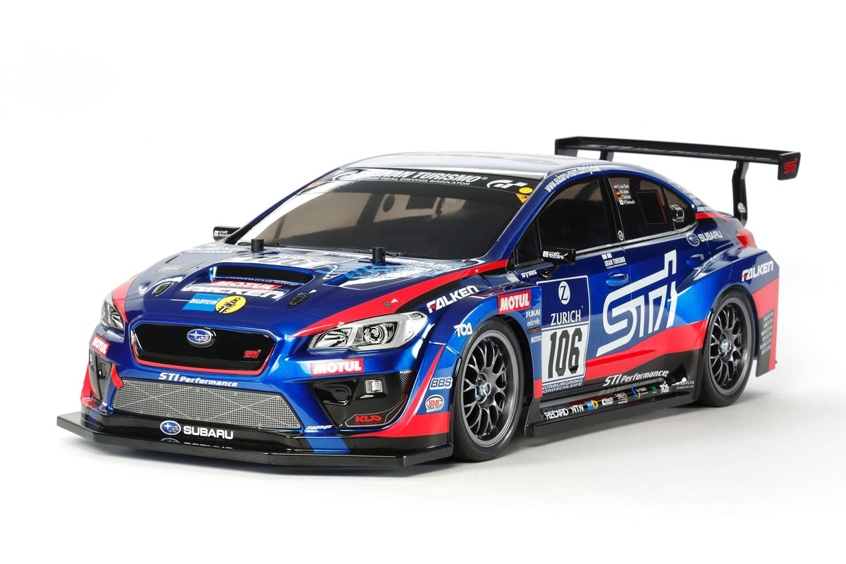 Tamiya TT-02 Subaru WRX STI 24H Nürburgring RC car kit with detailed body and racing decals on a black chassis.